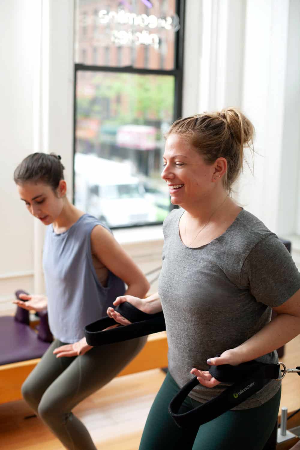 Brooklyn Pilates instructor teaching a Private session on the Reformer.